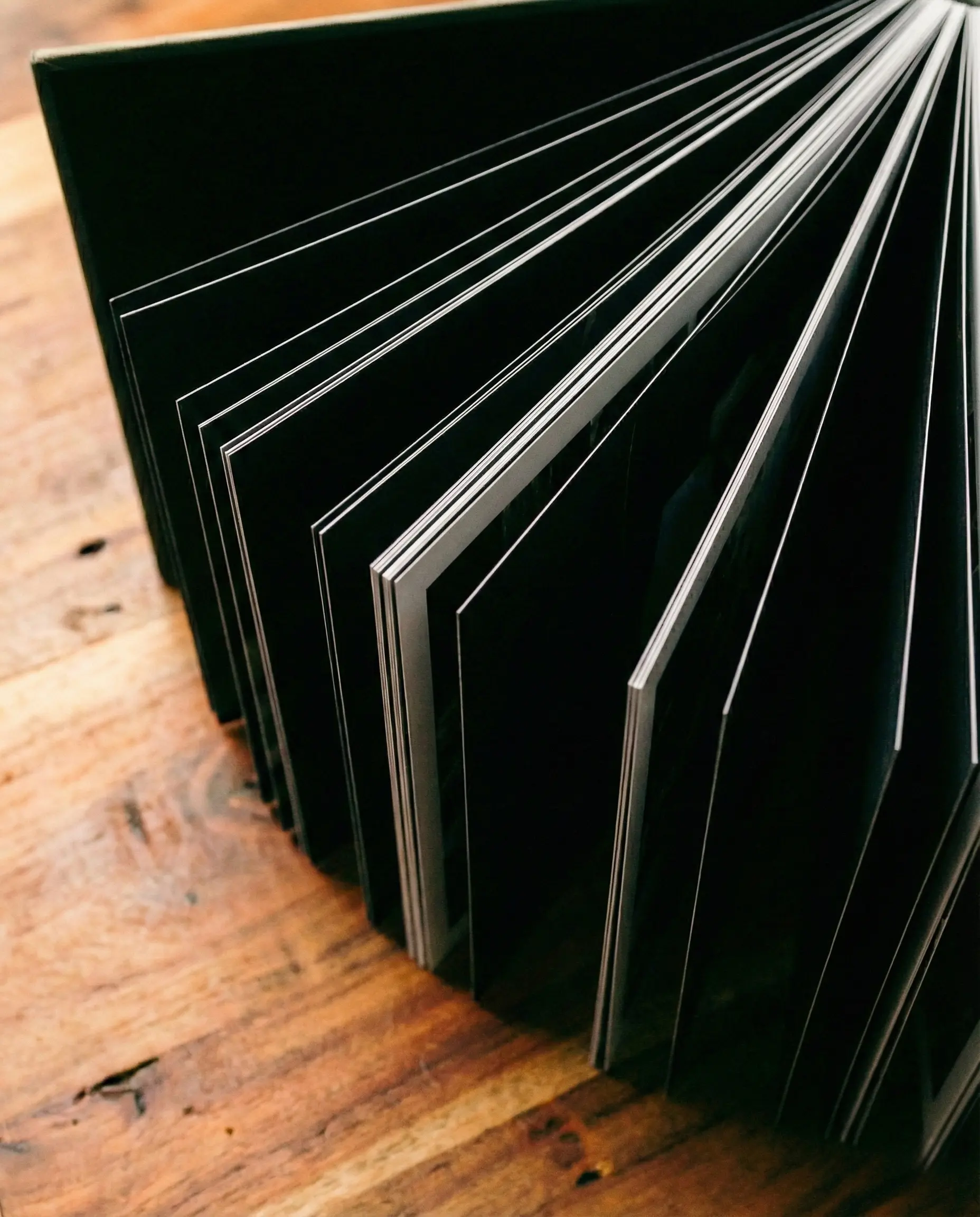 Example of a modern wedding album layout design featuring emotional storytelling photography