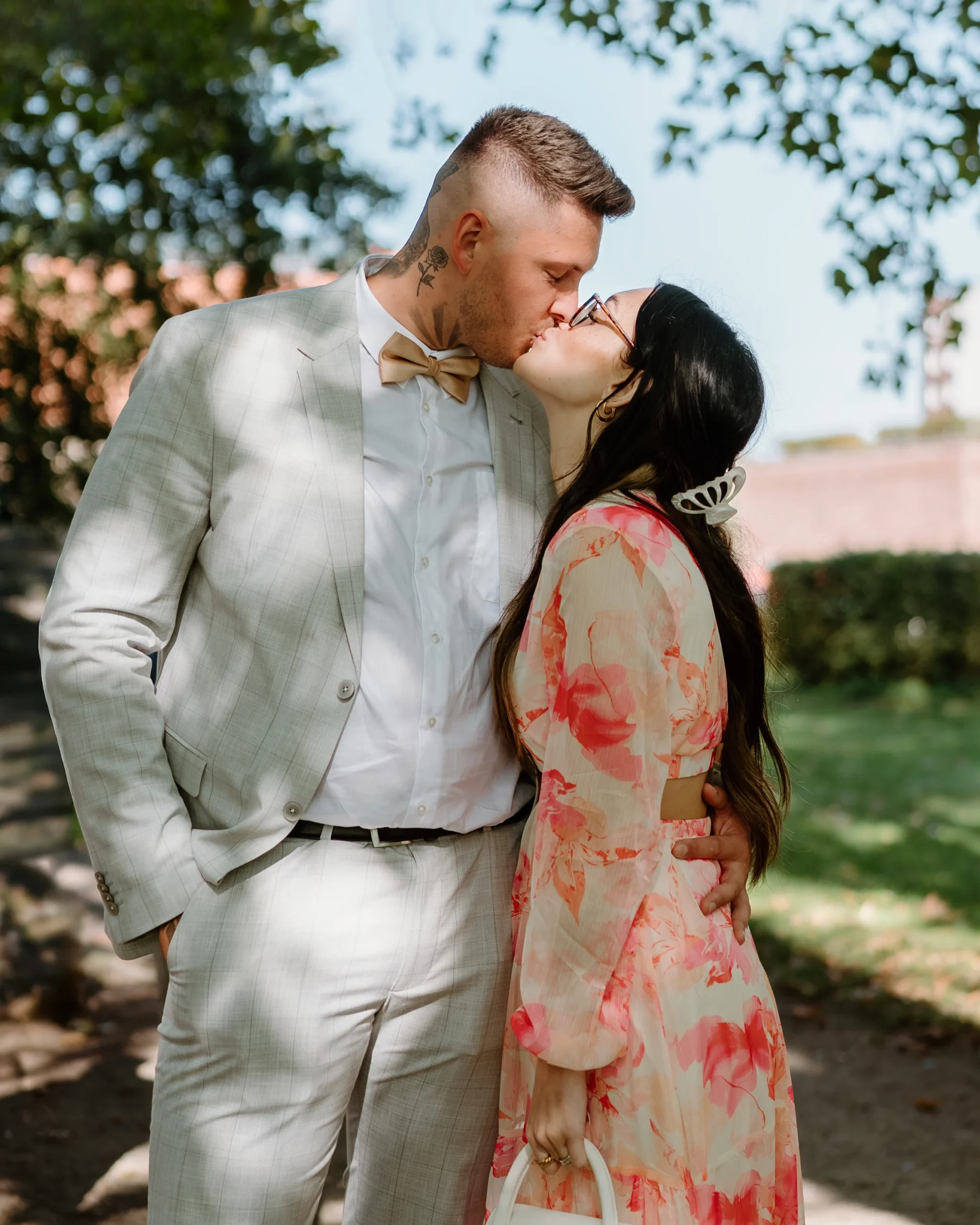 Wedding couple sharing a kiss during an outdoor celebration in Gelsenkirchen
